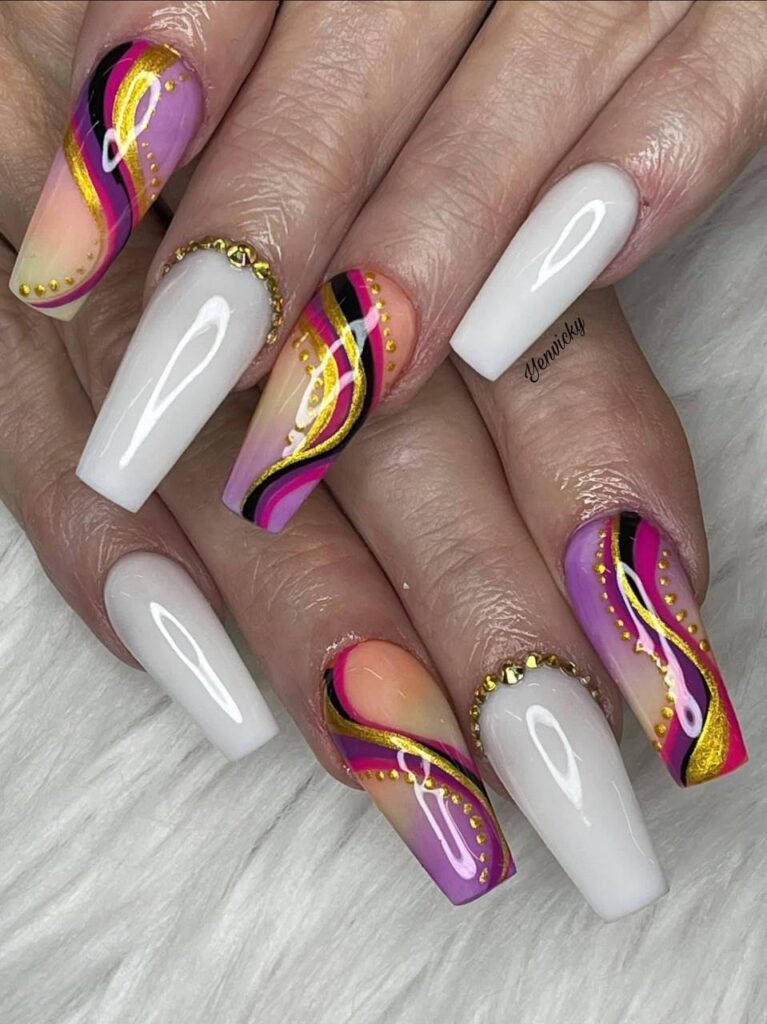 Elegant almond-shaped nails showcasing a vibrant fusion of white, pink, and yellow with intricate gold foil detailing, exemplifying the creative nail art at The Grand Nails of America in Houston, Texas.